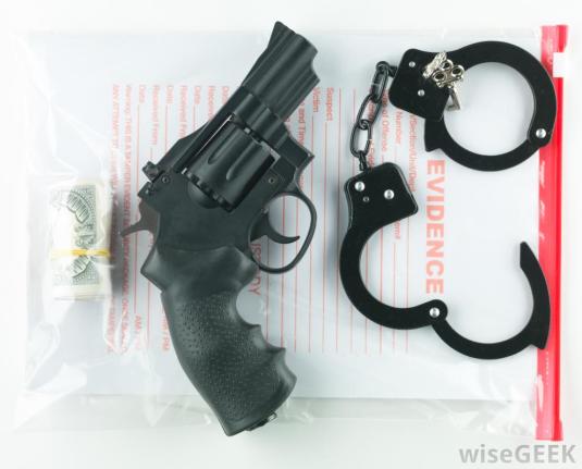 bag-labeled-evidence-with-gun-and-handcuffs